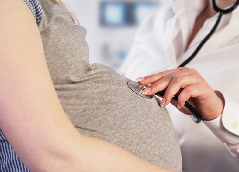 Doctor examining a pregnant woman Doctor examining a pregnant woman